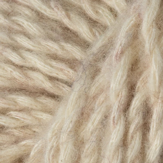 Flax: Berroco Stratto yarn close-up in cream and beige, showing its fluffy texture