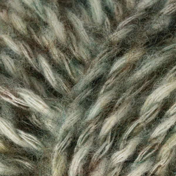 Pistachio: Berroco Stratto yarn close-up with muted green and cream marled strands.