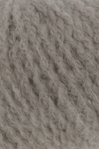 Beige: “Lang Yarns Cashmere Light yarn in beige 0196, close-up showing its fuzzy texture.”