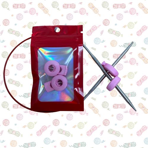 Point Protectors: A knitting needle set with a red drawstring bag, silver metal needles, and light purple knitted circular samples inside a holographic zip pouch, displayed on a white background with a repeating yarn ball pattern.