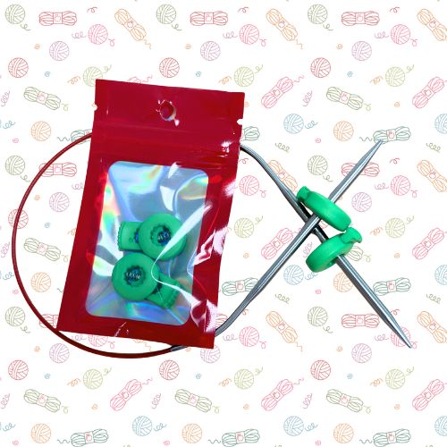 Point Protectors: A knitting needle set with a red zip pouch containing three green circular knitting needles, shown on a white background with a repeating pastel yarn pattern.