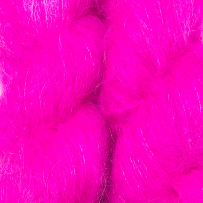 Bright hot pink fluffy faux fur or fiber texture filling the frame. Hand-dyed Cortland by Apple Fiber Studio in Alpaca and Silk at Apple Yarns.