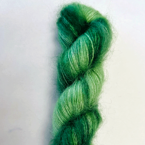 Photo of Apple Fiber Studio Delicious, color Juniper. Color description: tonal mix of deep green with blue undertones.